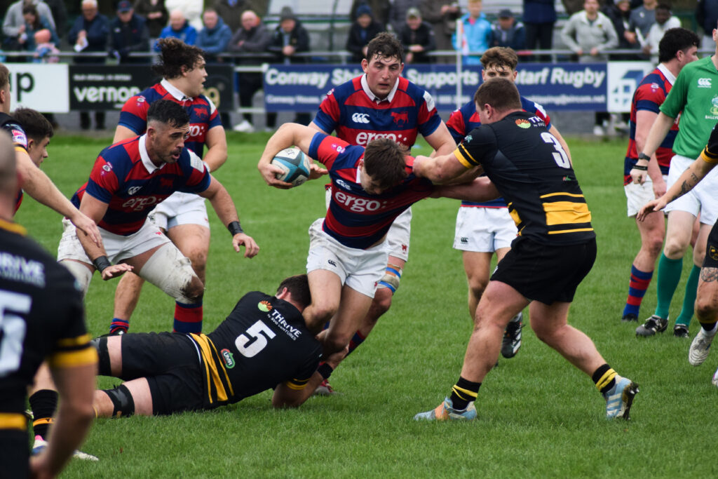 Clontarf’s Tadhgh Bird drives forward through contact during the All-Ireland League clash with Young Munster at Castle Avenue.