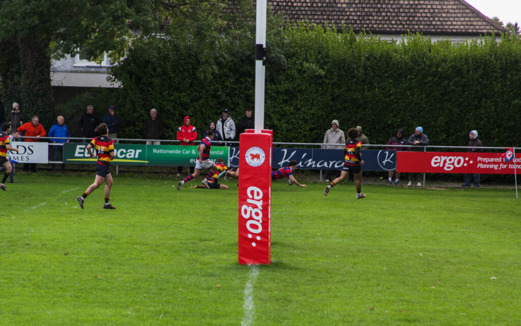 Peter Maher dives over in the corner to score Clontarf’s decisive try against Lansdowne at Castle Avenue.