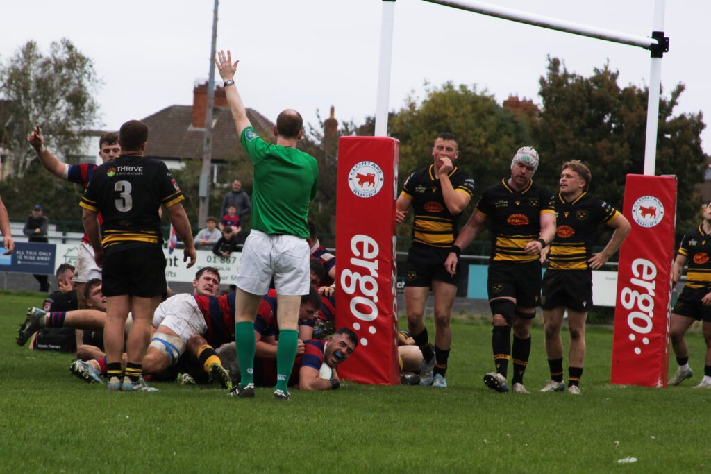 Clontarf’s Jordan Coghlan crashes over under the posts to extend the home side’s lead against Young Munster in the All-Ireland League.
