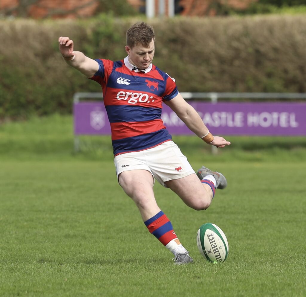 Con Kelly strikes a penalty kick for Clontarf during the 39–28 win over Lansdowne FC at Castle Avenue.