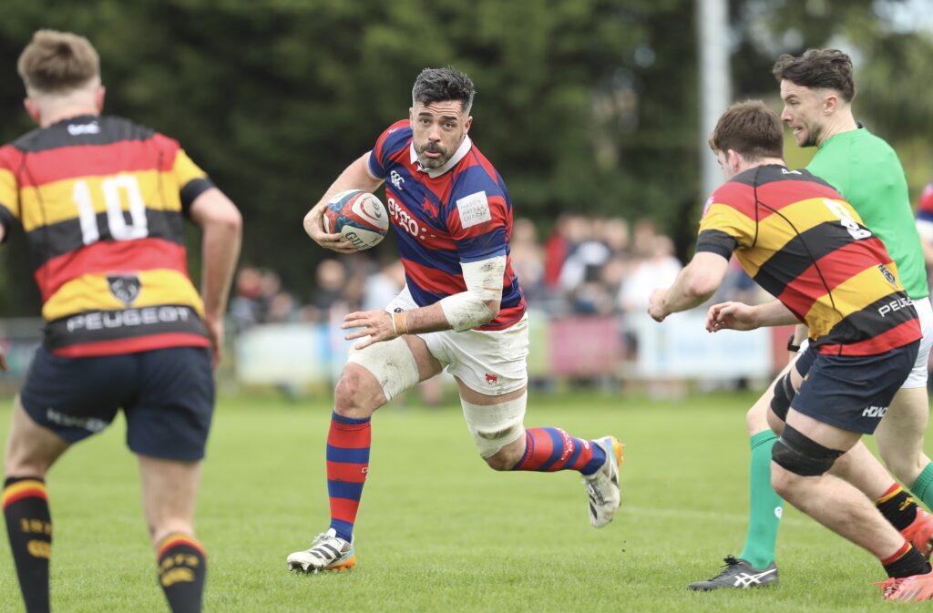 Jordan Coghlan carries the ball into contact for Clontarf during the 39–28 victory over Lansdowne FC at Castle Avenue.