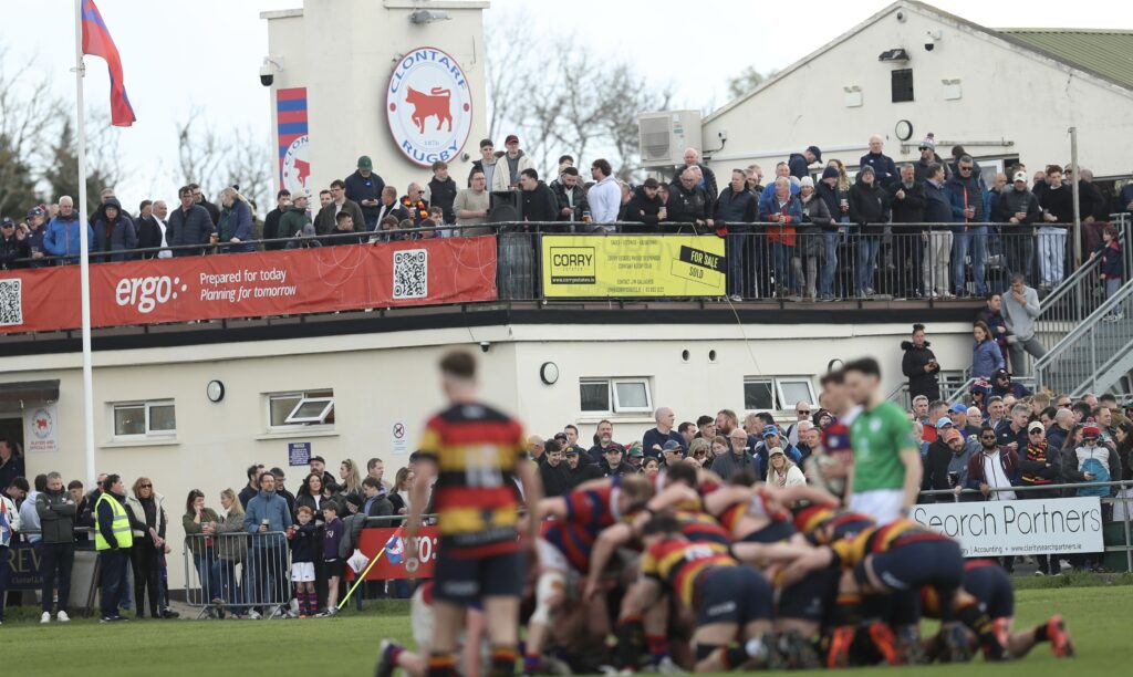Supporters watch from the touchline and balcony at Castle Avenue during Clontarf’s 39–28 victory over Lansdowne FC.