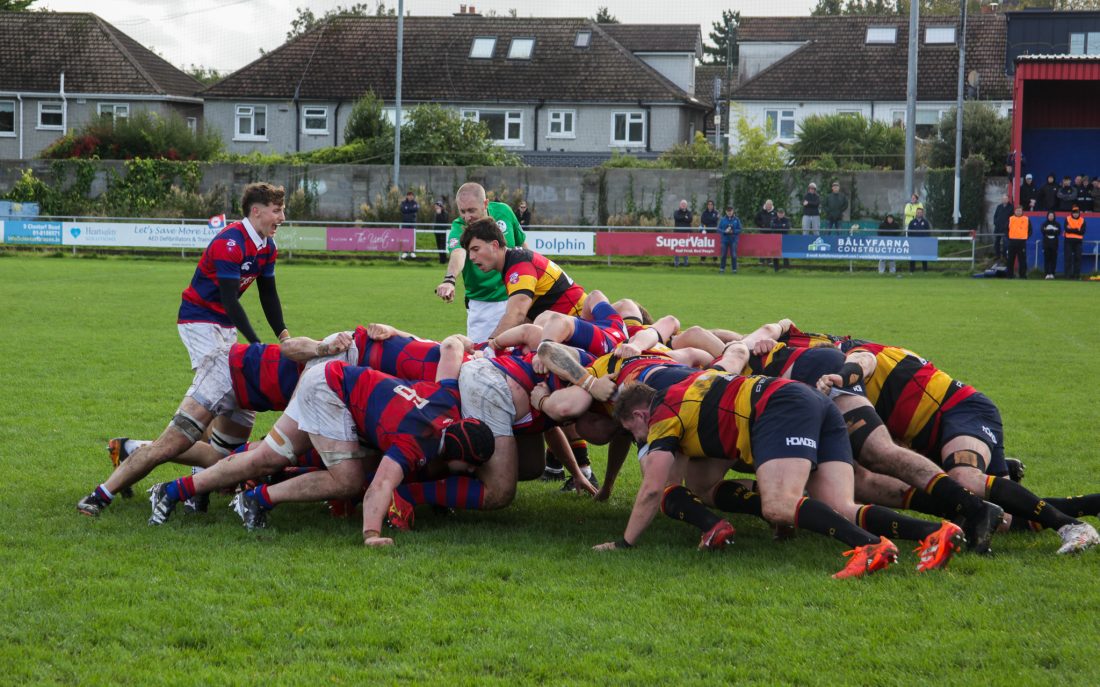 Clontarf scrum-half Sam Owens urging on his pack during a powerful scrum against Lansdowne at Castle Avenue.
