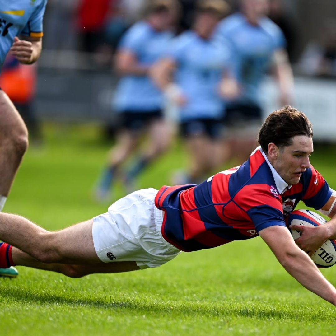 Clontarf’s Matthew Brennan scoring his team’s third try against UCD at Castle Avenue.