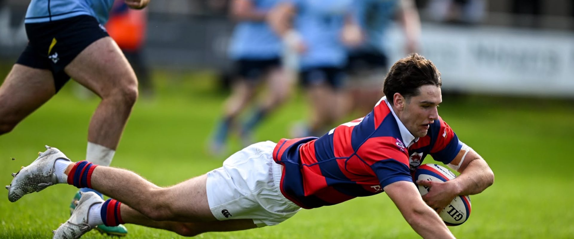 Clontarf’s Matthew Brennan scoring his team’s third try against UCD at Castle Avenue.